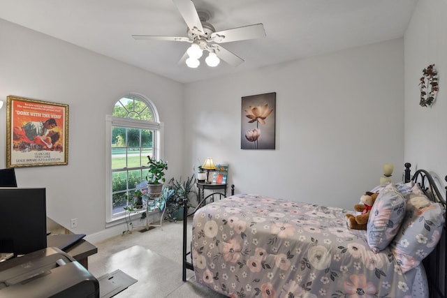 bedroom featuring light carpet and ceiling fan