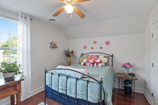 bedroom featuring ceiling fan, dark hardwood / wood-style flooring, and vaulted ceiling