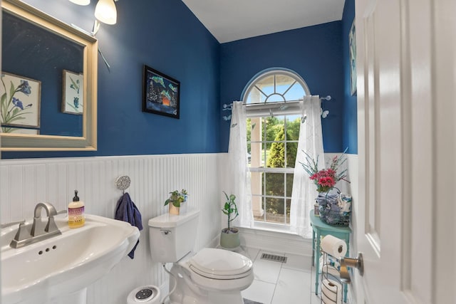 bathroom featuring tile patterned flooring, sink, and toilet