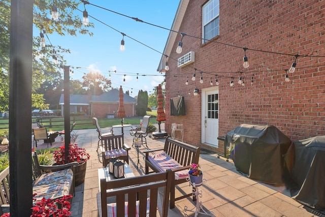 view of patio featuring grilling area and a wall mounted AC