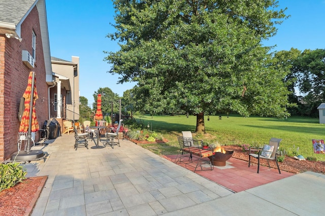 view of patio / terrace featuring a fire pit