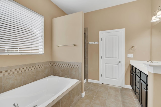 bathroom featuring tile patterned flooring, vanity, independent shower and bath, and a healthy amount of sunlight