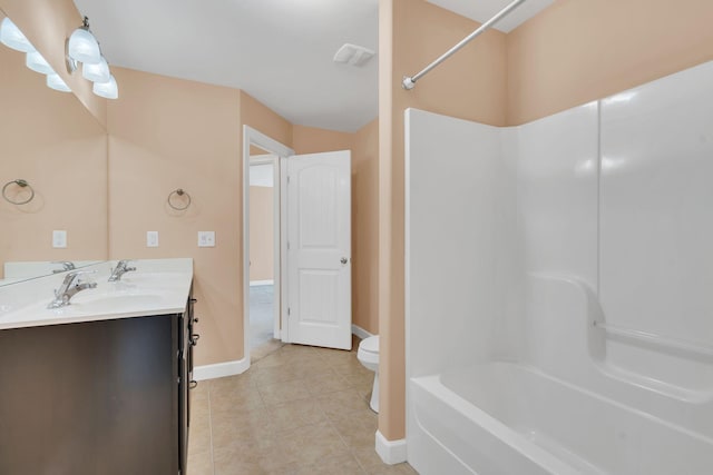 bathroom with vanity, tile patterned floors, and toilet