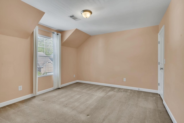 bonus room featuring light carpet