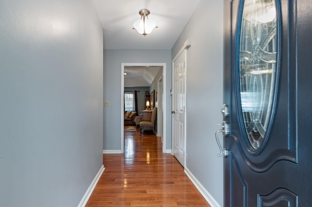 entrance foyer with wood finished floors and baseboards