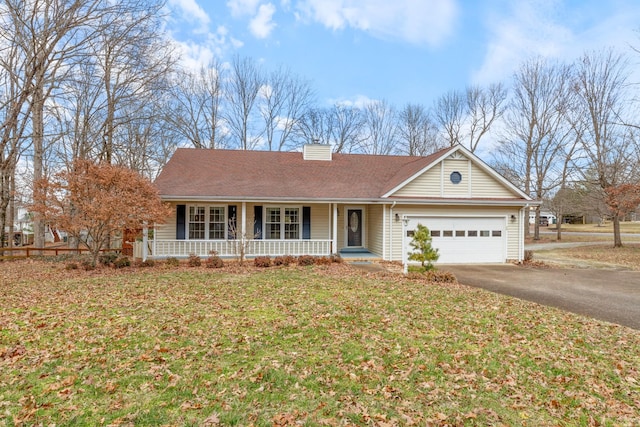 ranch-style house with a garage, a front yard, and covered porch