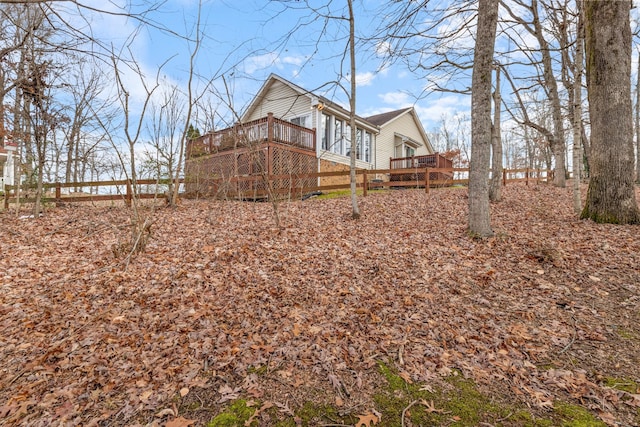 exterior space featuring a wooden deck