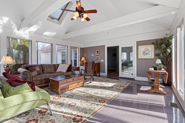 tiled living room featuring vaulted ceiling with beams and ceiling fan