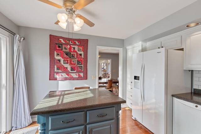 kitchen featuring white appliances, ceiling fan, gray cabinets, light wood-type flooring, and white cabinetry