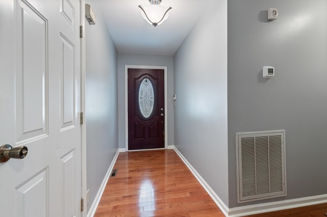 doorway to outside with light wood-type flooring