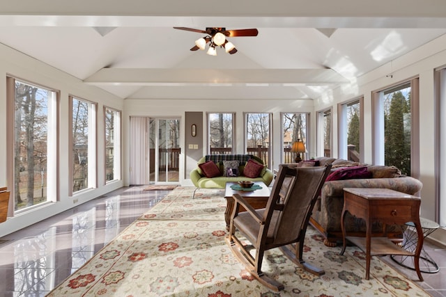 sunroom featuring vaulted ceiling and ceiling fan