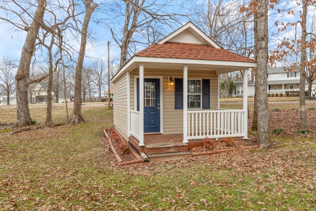 view of outbuilding featuring covered porch