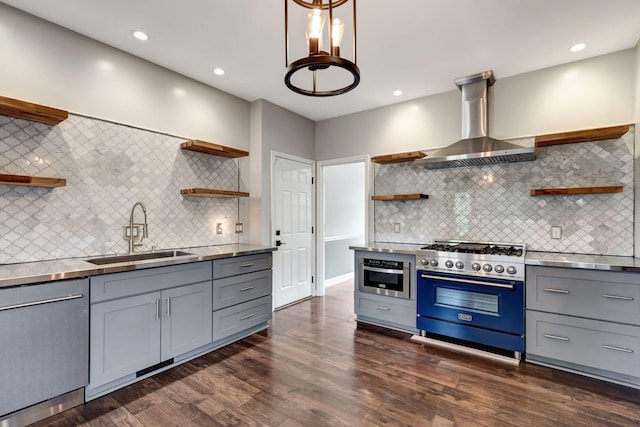 kitchen featuring gray cabinets, appliances with stainless steel finishes, sink, and wall chimney exhaust hood