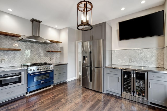 kitchen featuring wine cooler, stainless steel appliances, gray cabinets, and exhaust hood