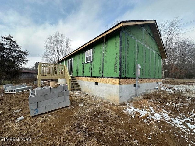 view of property exterior featuring a deck