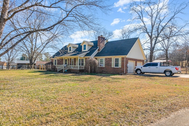 cape cod home with a garage, a front yard, and covered porch