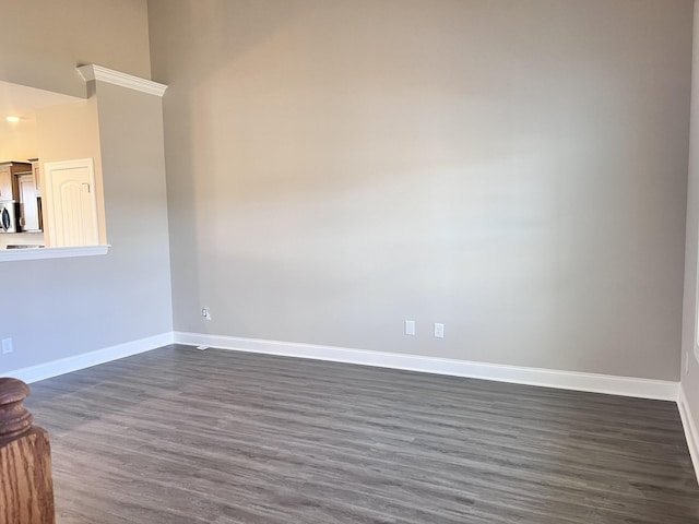 unfurnished room featuring dark hardwood / wood-style floors