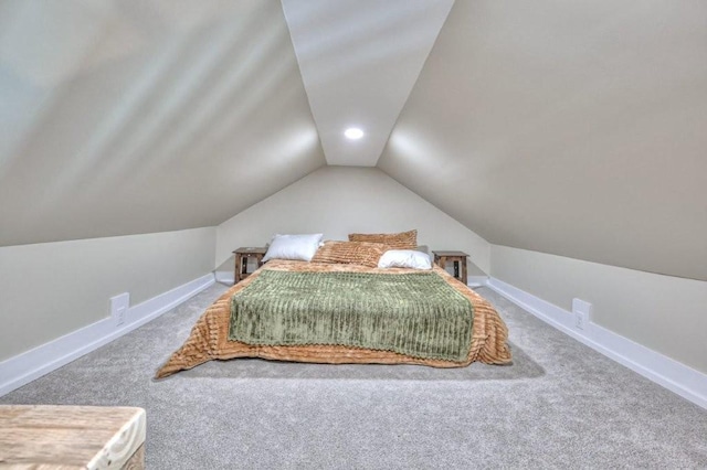 bedroom featuring vaulted ceiling and carpet flooring