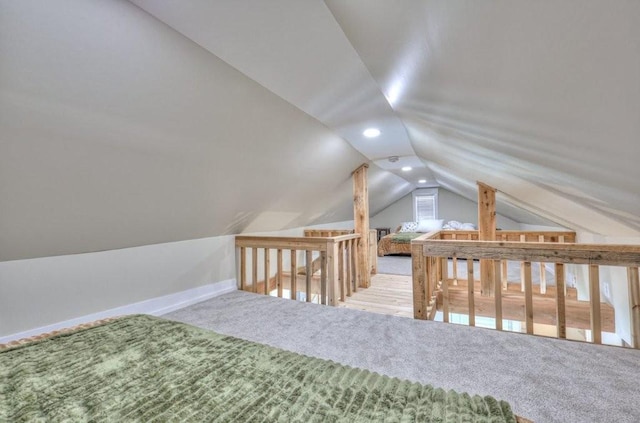 additional living space with lofted ceiling and carpet floors