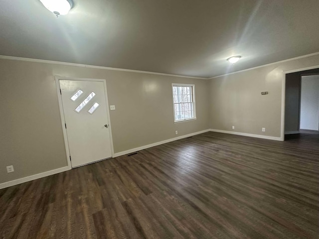 entryway with crown molding and dark hardwood / wood-style flooring