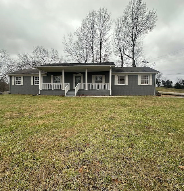 single story home with a front lawn and covered porch