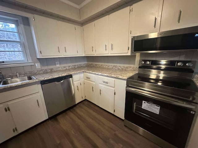 kitchen featuring sink, stainless steel appliances, dark hardwood / wood-style floors, and white cabinets