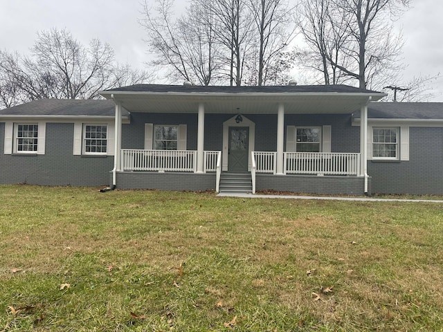 view of front of home with a porch and a front lawn