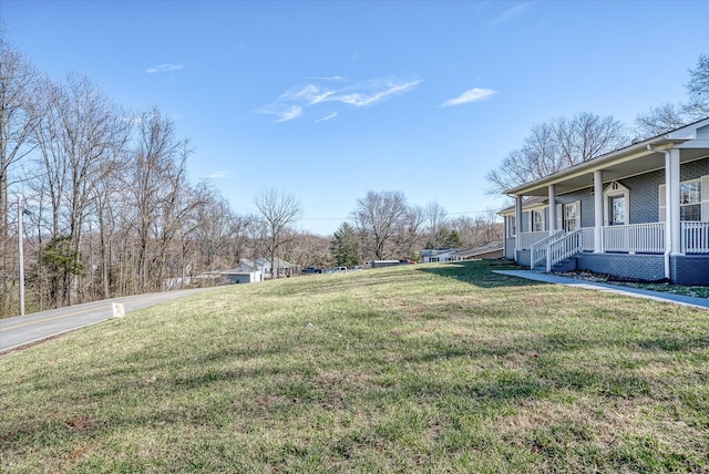 view of yard featuring a porch