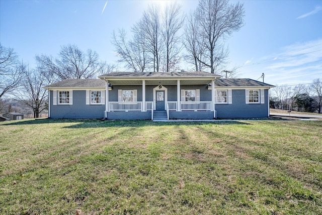 view of front of property with covered porch, brick siding, and a front lawn