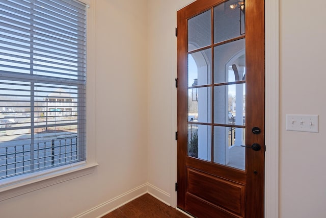 doorway to outside with wood-type flooring