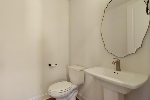 bathroom with toilet and sink