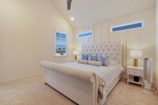 bedroom featuring ceiling fan, lofted ceiling, and light colored carpet