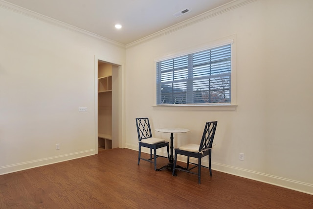 living area with crown molding and dark hardwood / wood-style floors