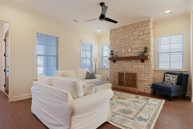 living room with crown molding, a wealth of natural light, dark hardwood / wood-style floors, and ceiling fan