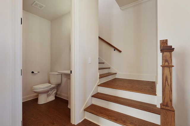 staircase with hardwood / wood-style flooring