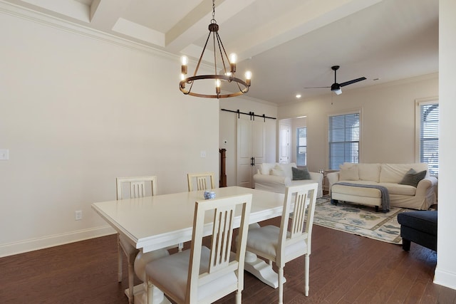 dining space with beamed ceiling, a barn door, dark hardwood / wood-style floors, and ceiling fan with notable chandelier