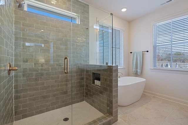 bathroom with tile patterned flooring and plus walk in shower