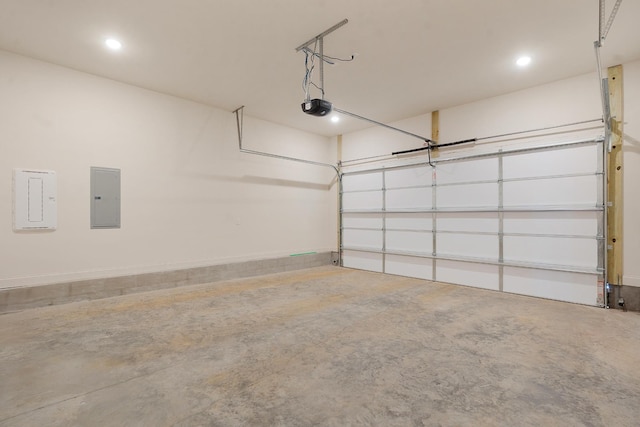 garage featuring a garage door opener and electric panel