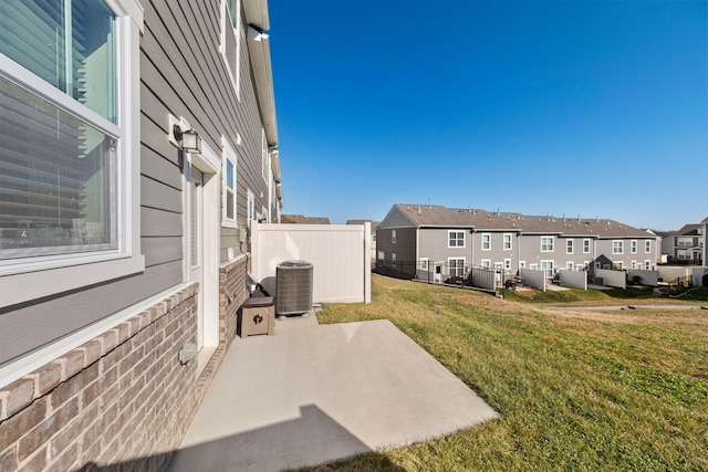 view of yard with a patio and central AC