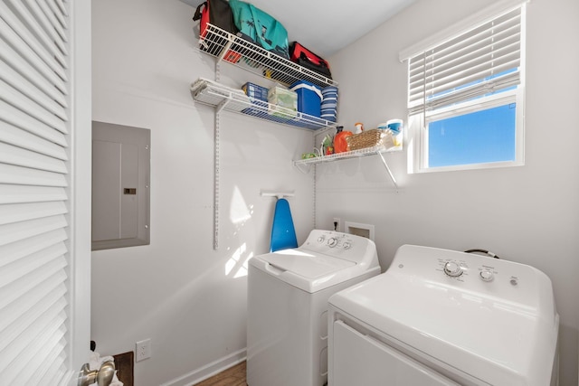 clothes washing area with independent washer and dryer and electric panel