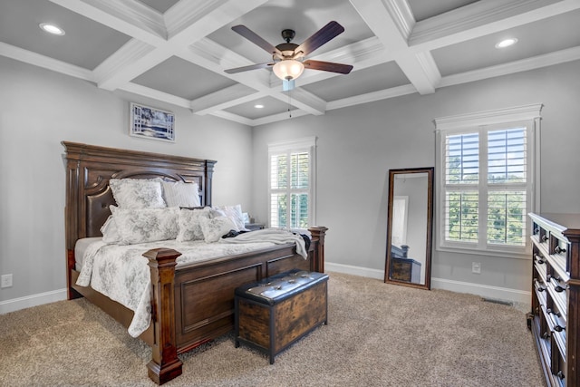 bedroom featuring coffered ceiling, crown molding, light carpet, ceiling fan, and beam ceiling