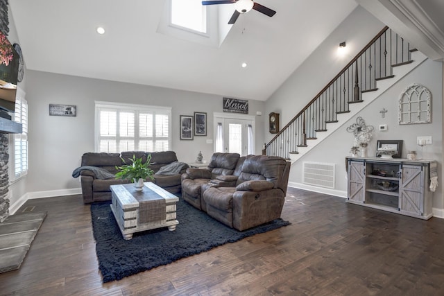 living room with ceiling fan, dark hardwood / wood-style flooring, and high vaulted ceiling