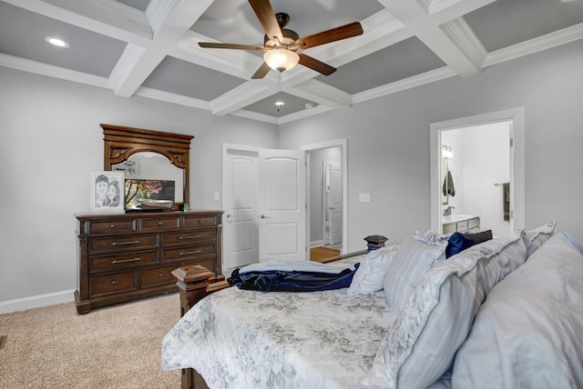 bedroom featuring beam ceiling, light colored carpet, ceiling fan, and ensuite bath