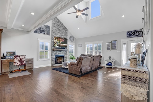 living room with ceiling fan, beam ceiling, high vaulted ceiling, dark hardwood / wood-style flooring, and a stone fireplace