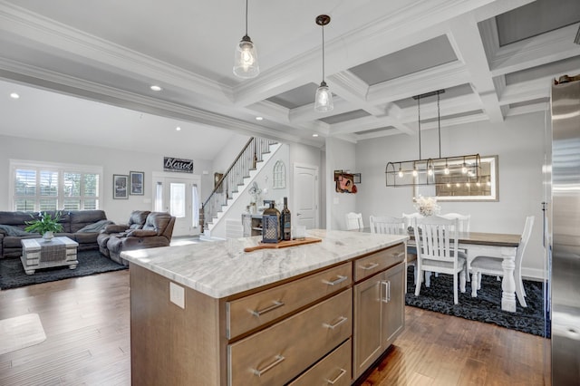 kitchen featuring pendant lighting, dark hardwood / wood-style floors, coffered ceiling, a kitchen island, and beamed ceiling