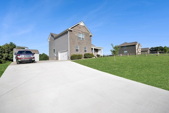 exterior space with a garage and a front lawn