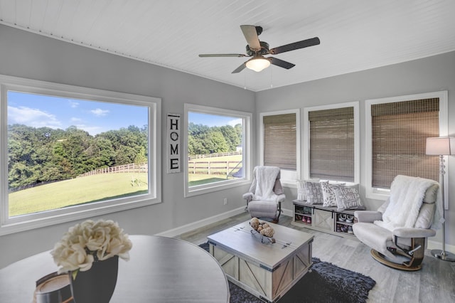 sunroom / solarium with ceiling fan