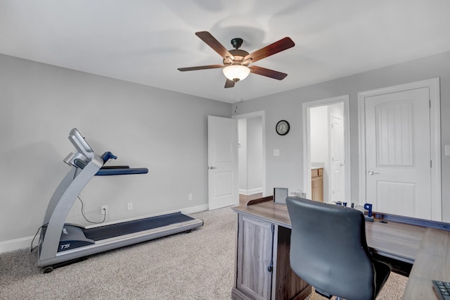 carpeted home office with ceiling fan