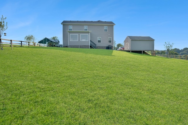 back of house featuring a lawn