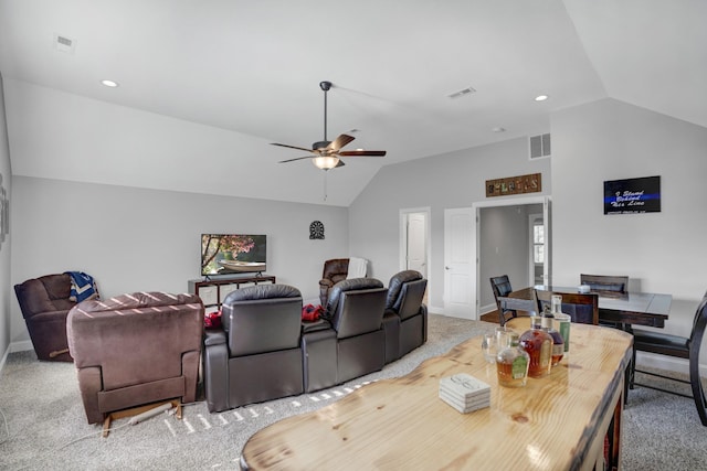 dining area featuring vaulted ceiling, ceiling fan, and carpet flooring